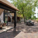 Serre met vouwwand en weids uitzicht