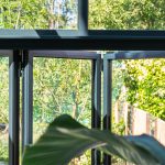 Serre met bovenlichten en vouwwand